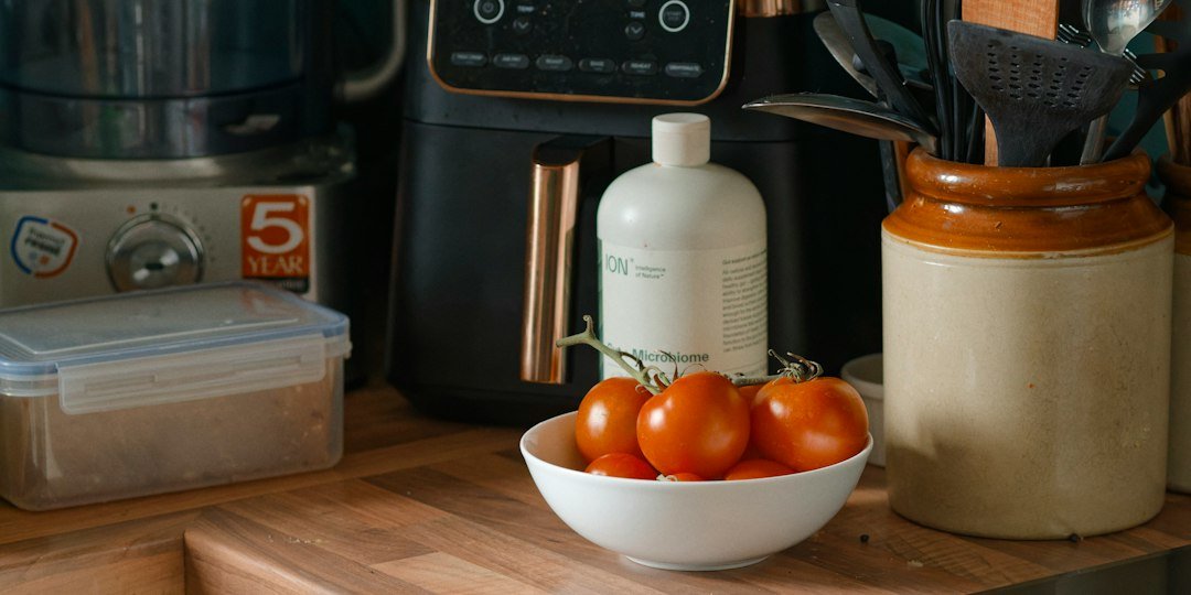 Tomatoes and kitchen appliances on a counter
